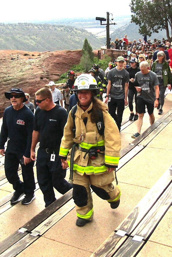 Assistant Chief Stacee Martin with Evergreen Fire/Rescue is still smiling after completing her third lap in the  9/11 Memorial Stair Climb at Red Rocks Amphitheatre.